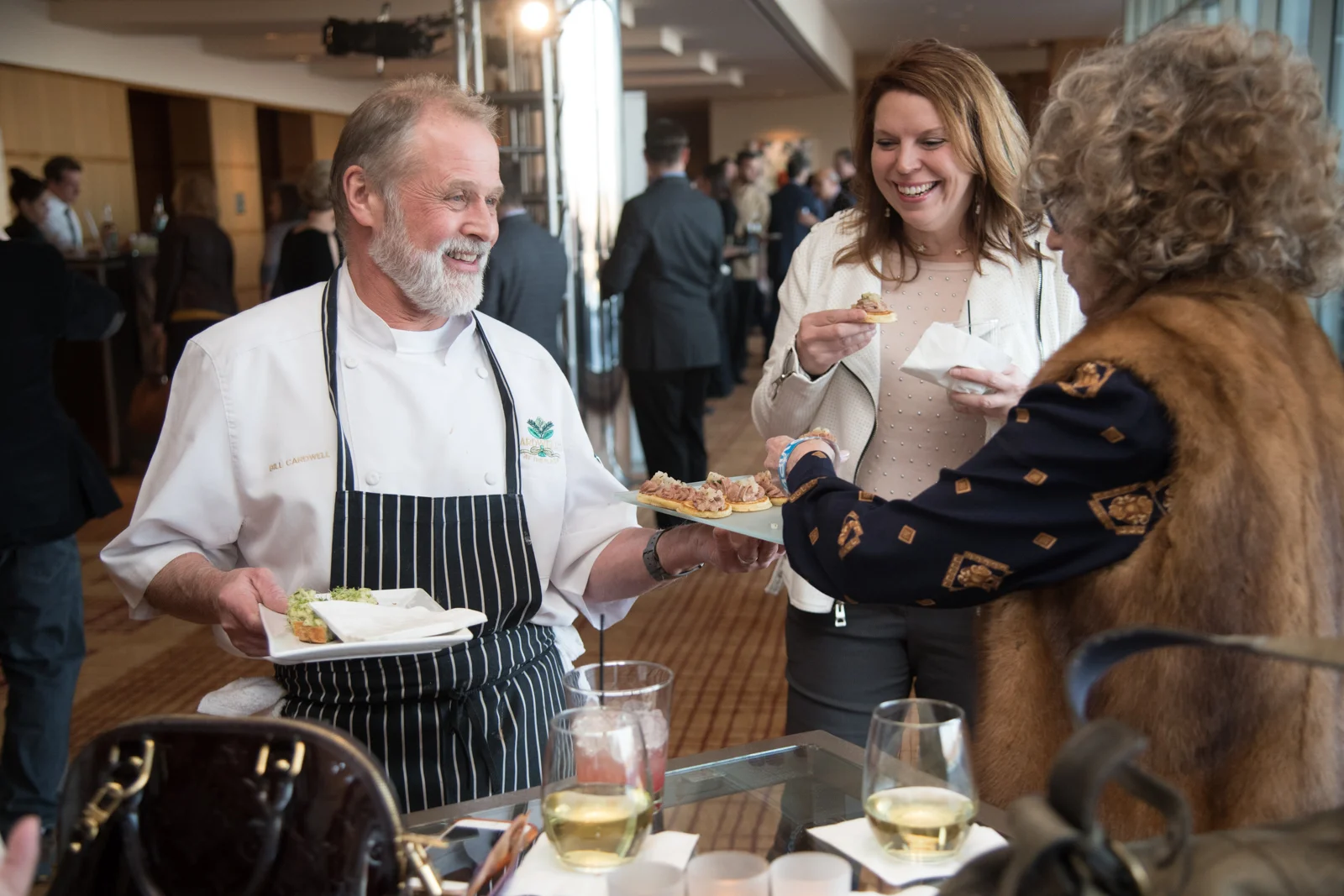 Chef Bill Cardwell (Cardwell's at the Plaza, BC's Kitchen) offers guests appetizers during night one of St. Louis Magazine's Food Wine Design at the Four Seasons Hotel