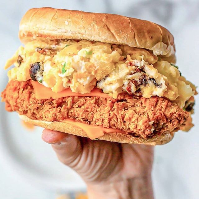 We're officially declaring this @atlas.monroe⚡ EXTRA ⚡crispy chick'n sandwich week because you all are on a roll!!! Here's @vegantraveleats with the decadent BACON 🥓 &amp; CHEDDAR 🧀 potato salad making this sandwich a true BANGER🔥🔥🔥😳😳😳!!! #ju