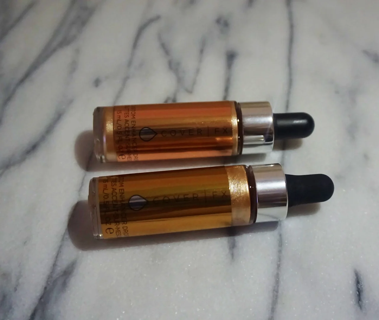  Here are the photos of the CoverFx highlighting drops without a flash. They reflect light so well, it was very difficult for me to take a photo of them with the flash of my camera! 