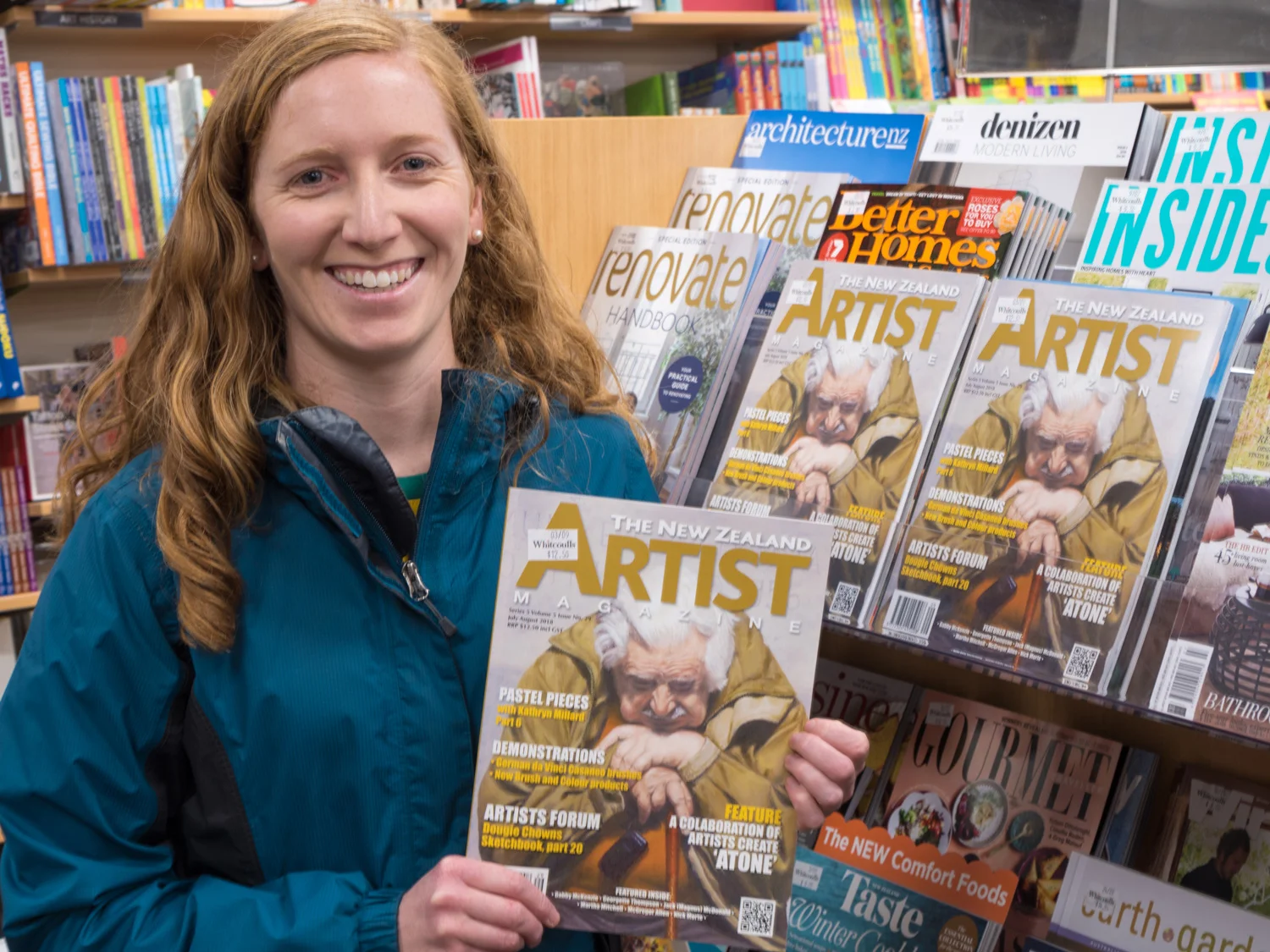 A very excited Georgette holding her cover of the New Zealand Artist magazine at the local bookstore.