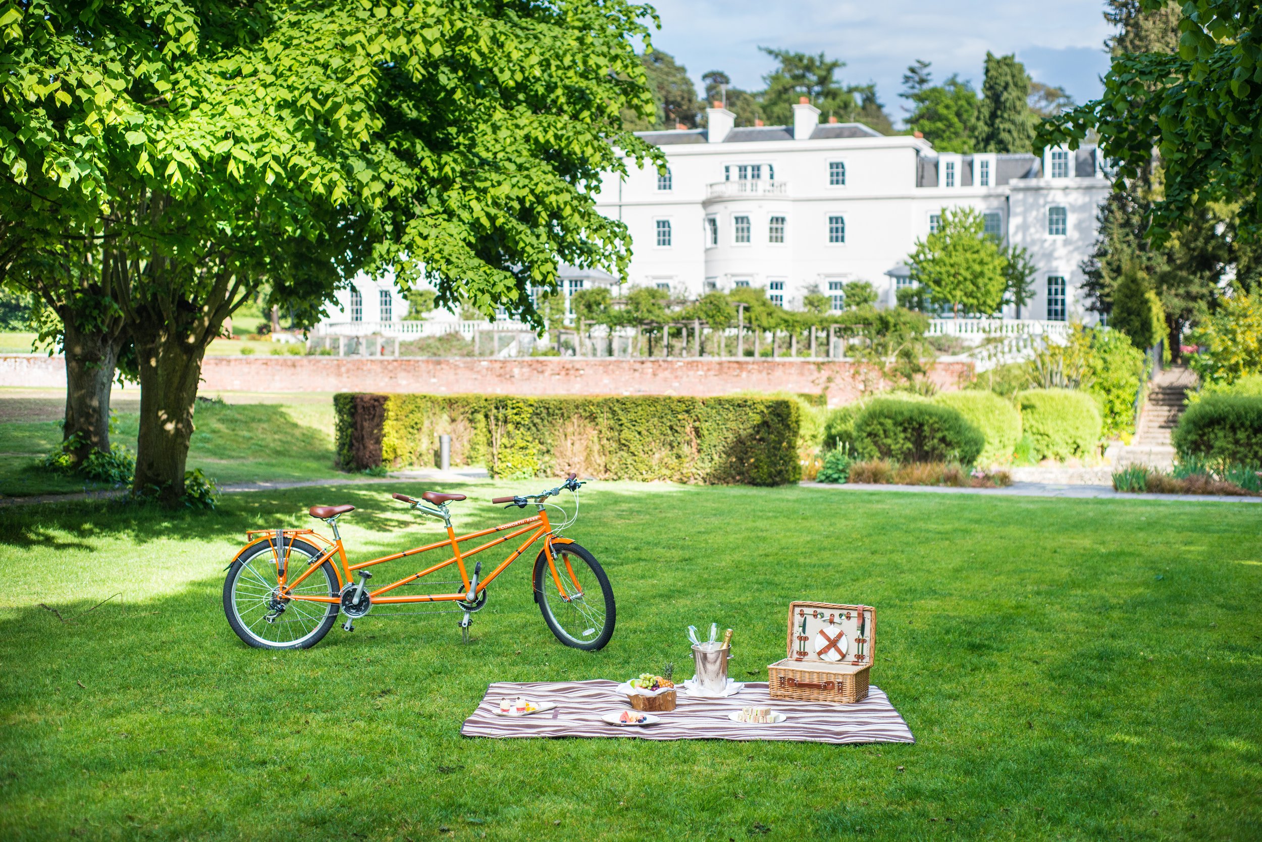 Coworth Park-Bicycle menu-Tandem bike and picnic in front of Mansion House-highres.jpeg