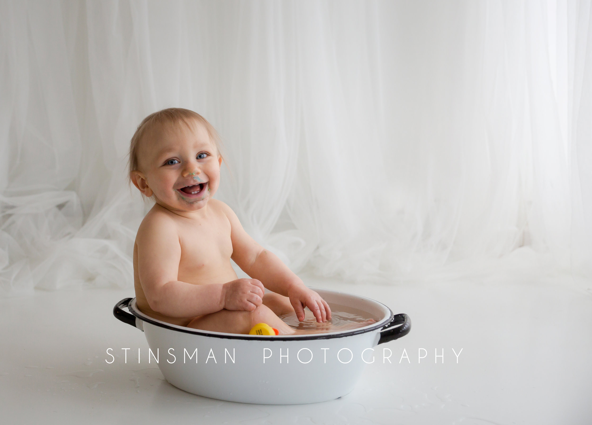 laughing baby boy in the tub