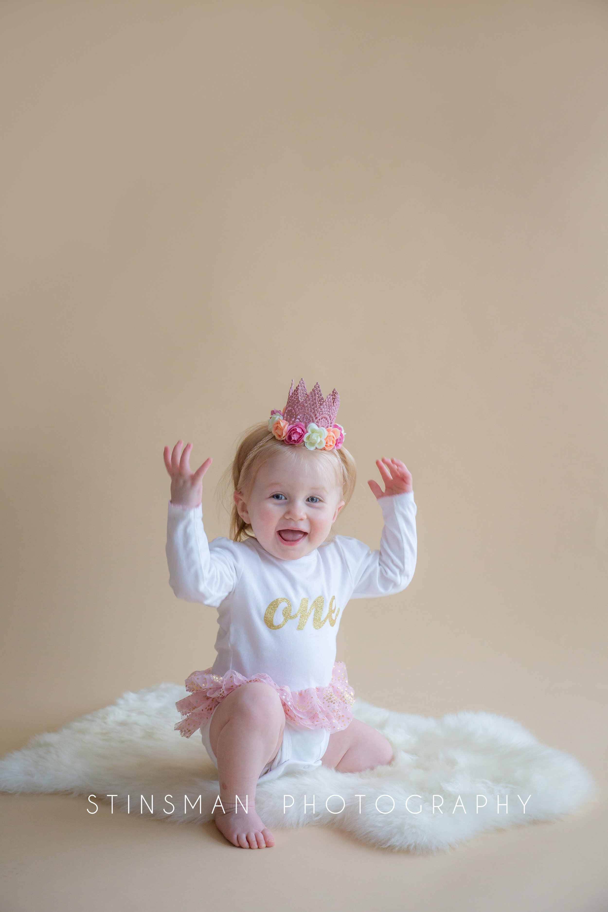 little girl wearing a crown for her first birthday photos