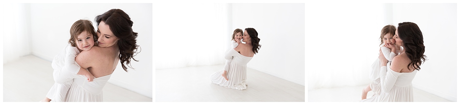 mom and daughter hugging and laughing for pregnancy photos