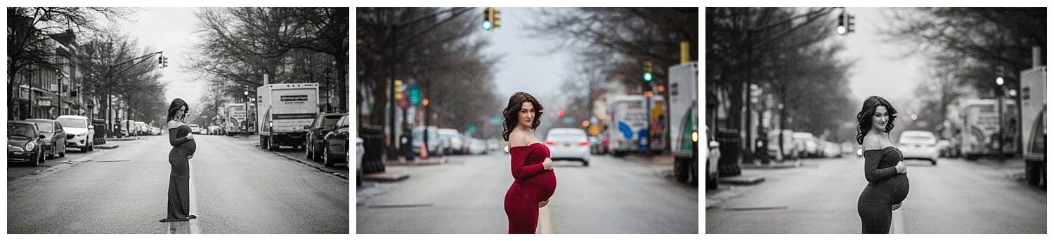 pregnant mom standing in the street holding her pregnant belly