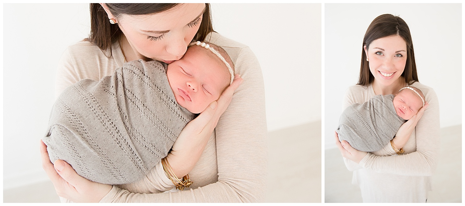 mom holding her newborn baby in south jersey newborn photo studio