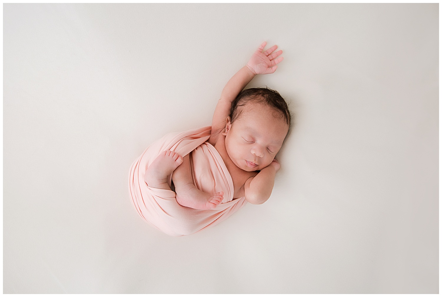 baby girl stretching at her newborn session in south jersey