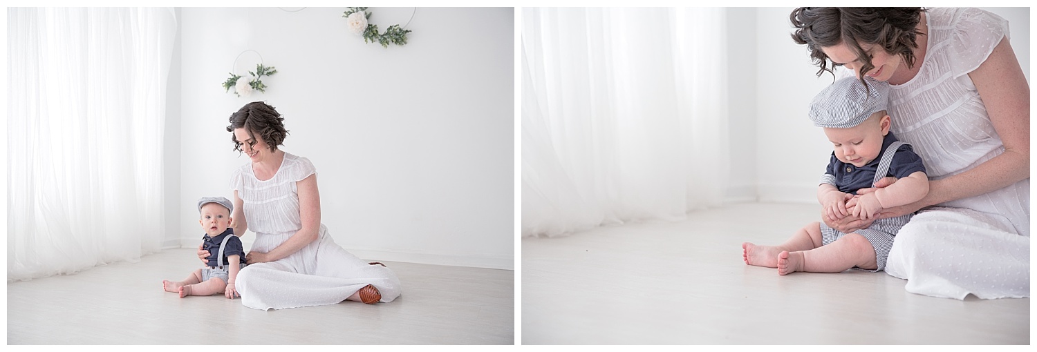 mom playing with her little boy on the floor wearing a white dress in moorestown new jersey studio