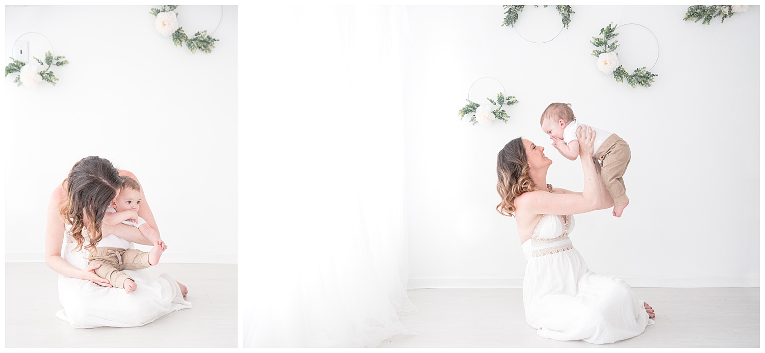 mom in a white dres with her 6 month old baby boy also wearing white in moorestown new jersey studio