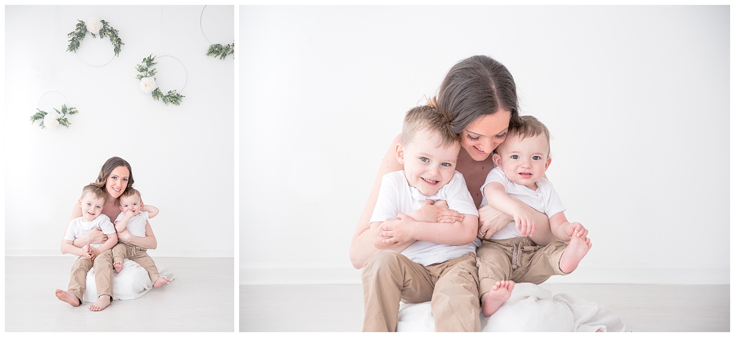 mom hugging her little boys in white studio in burlington new jersey photo shoot