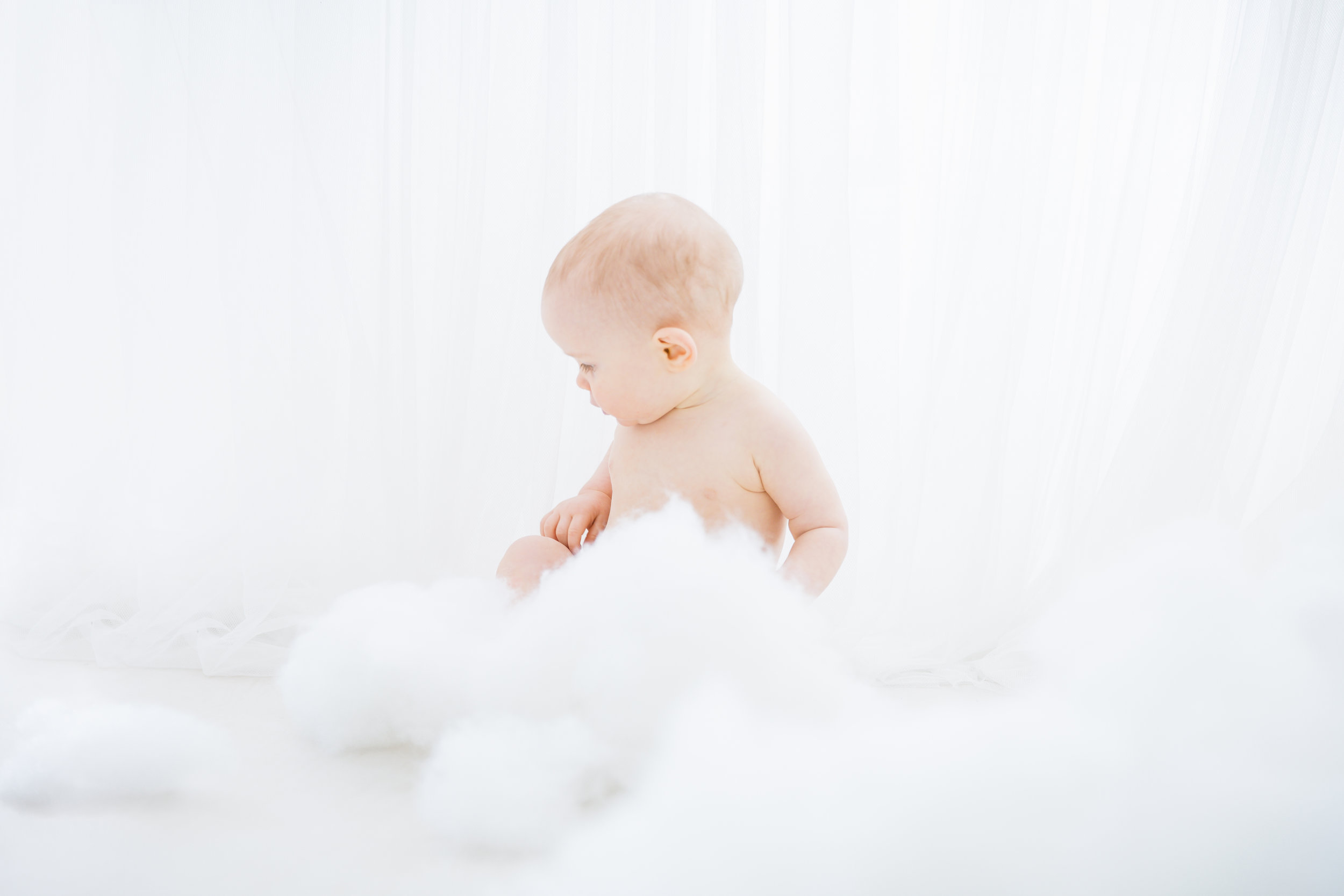 1 year old boy playing in clouds
