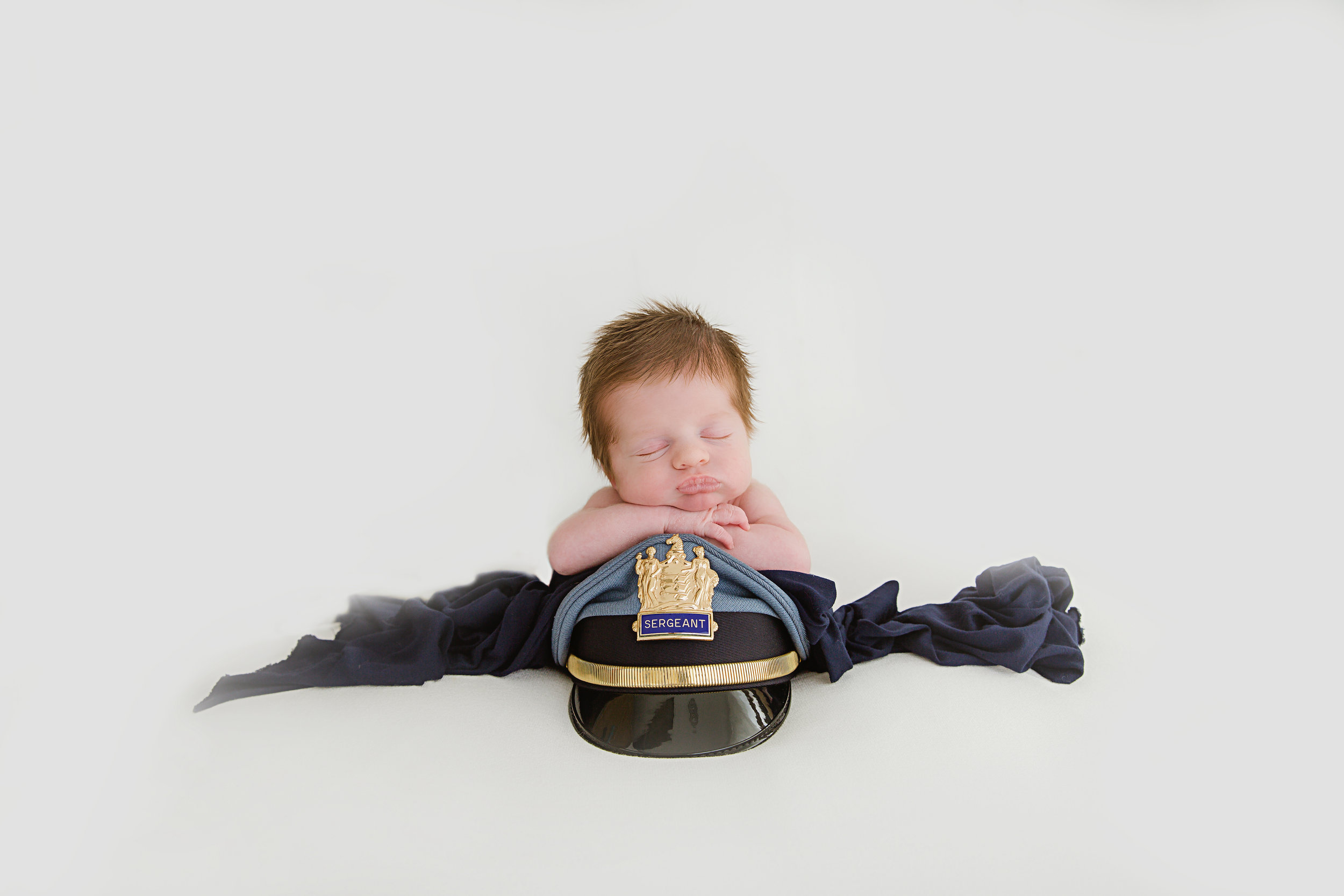 police officer baby boy pose