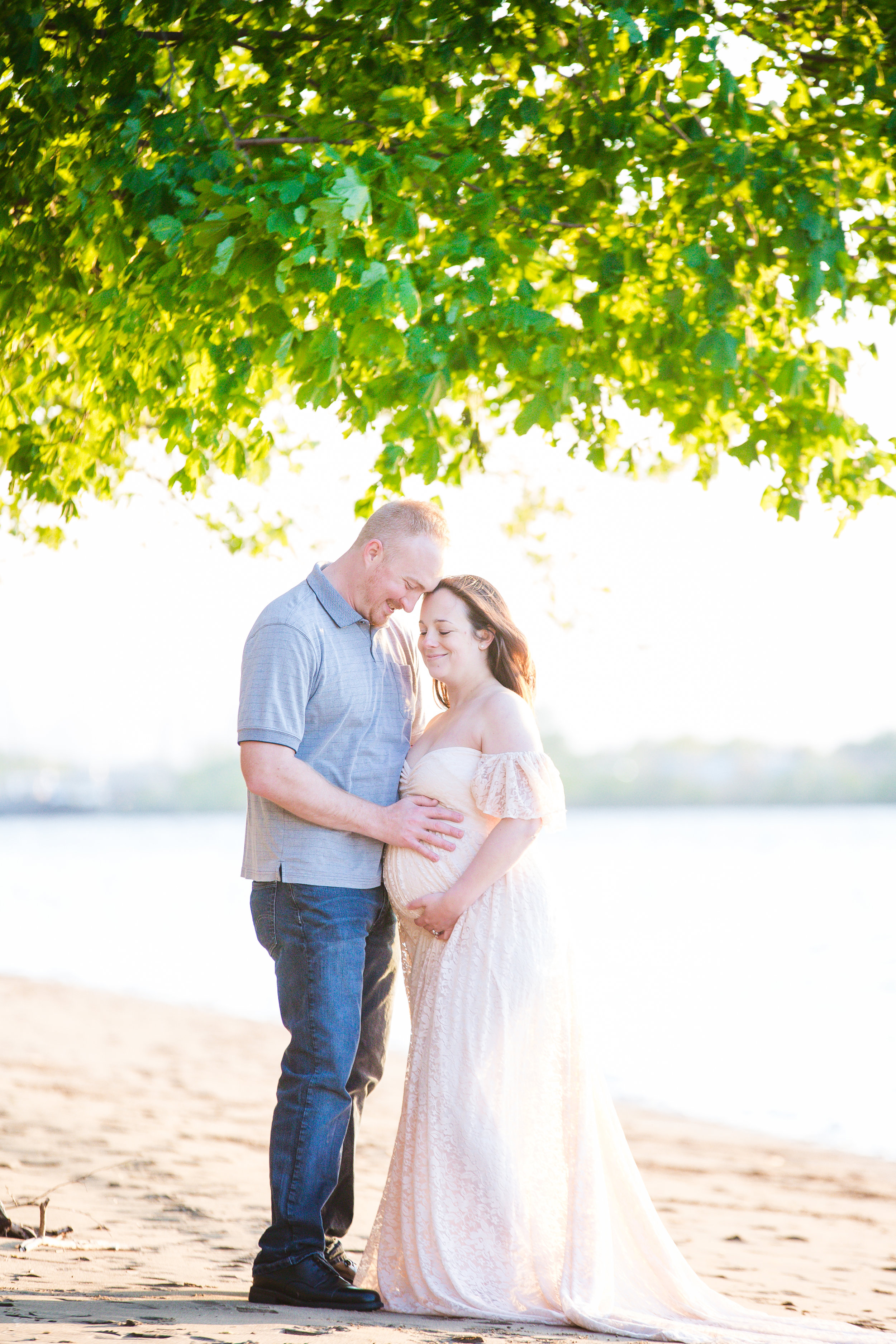 couple-holding-pregnant-belly-in-palmyra-nature-cove-burlington-county-new-jersey-photo-shoot.jpg