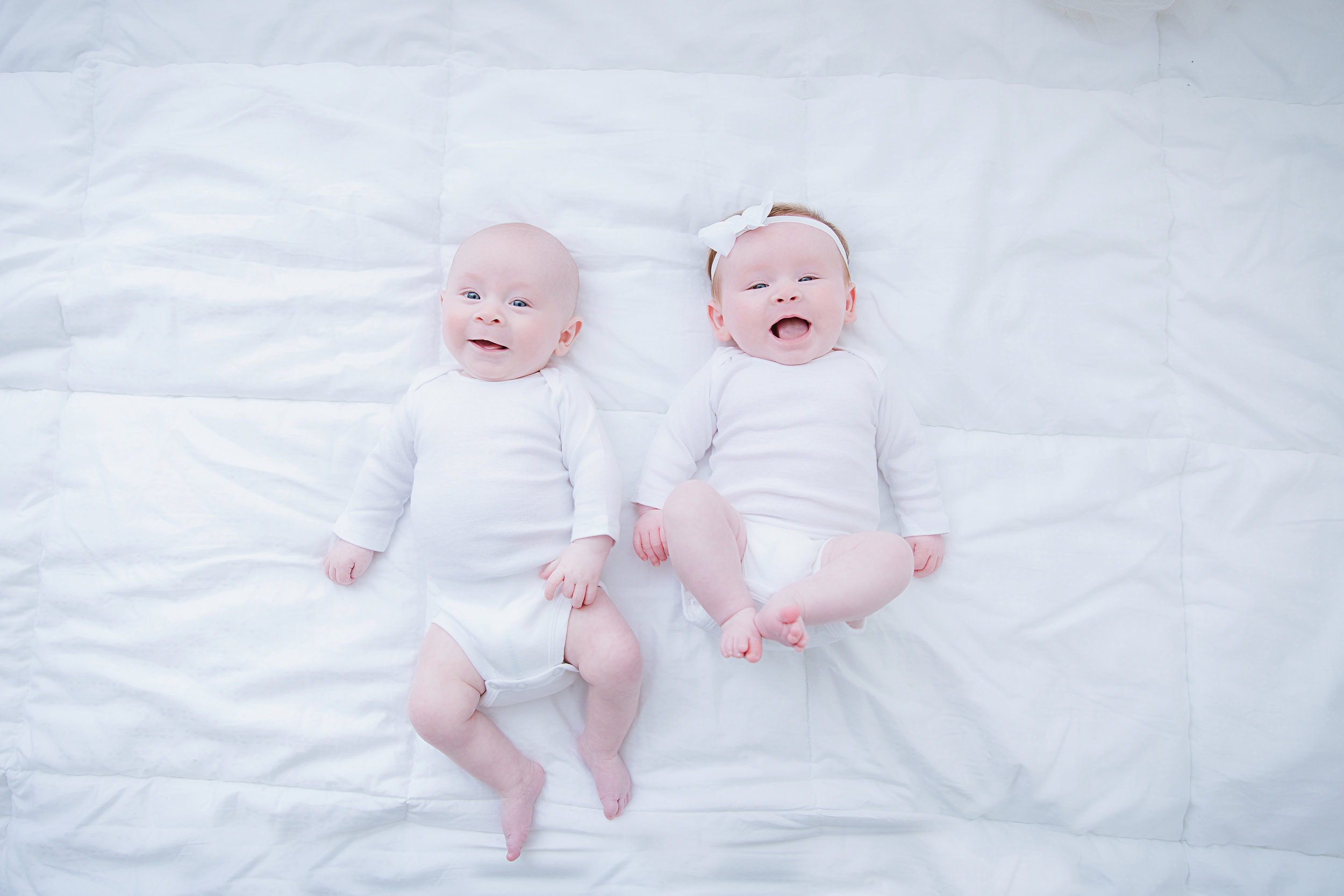 3-month-old-baby-twins-lying-down-photography-shoot-smiling-babies