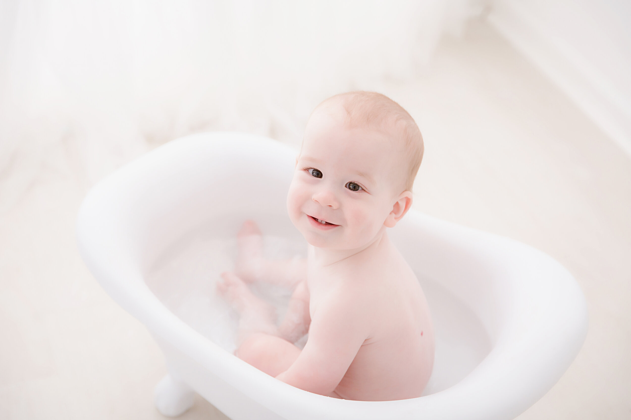 baby-boy-sitting-in-tub