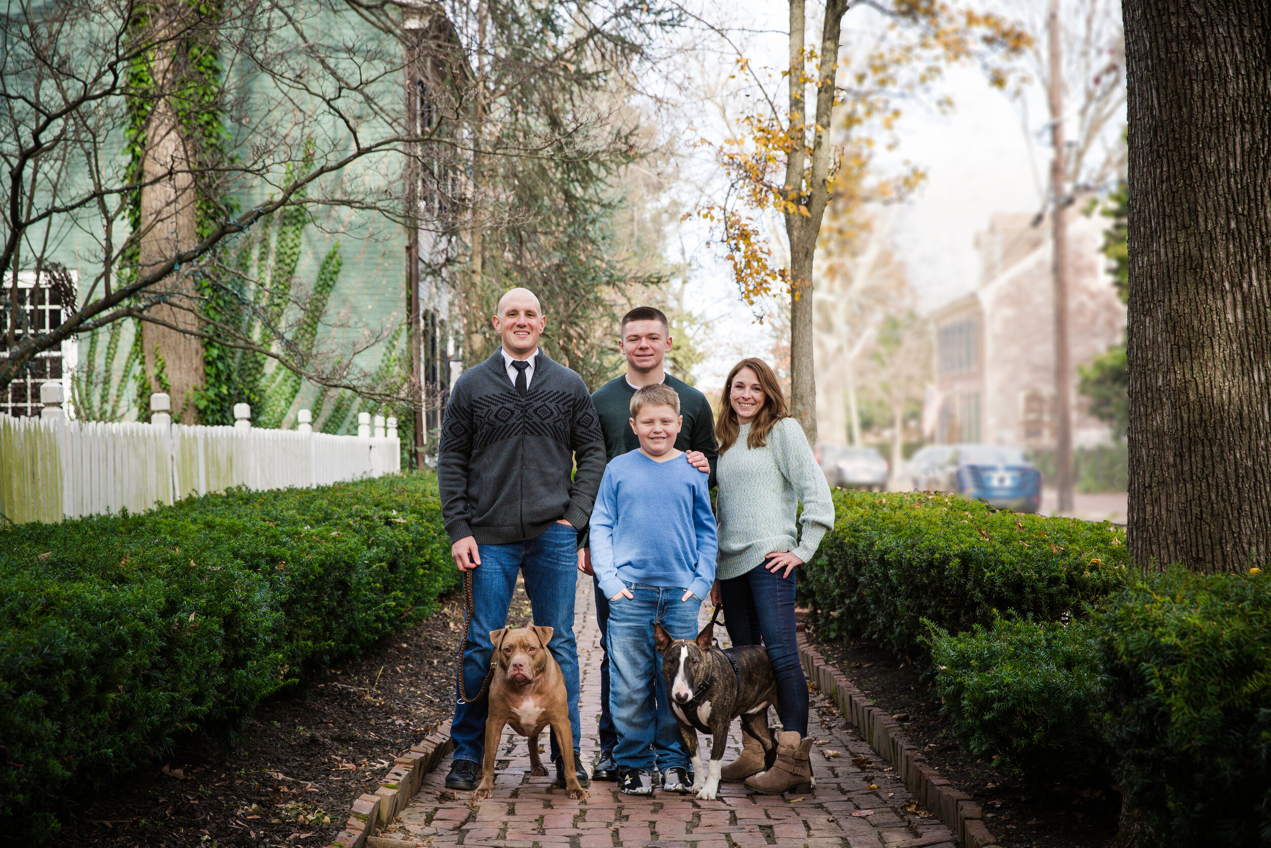 family-outdoor-fall-session-all-smiling-and-looking-at-camera