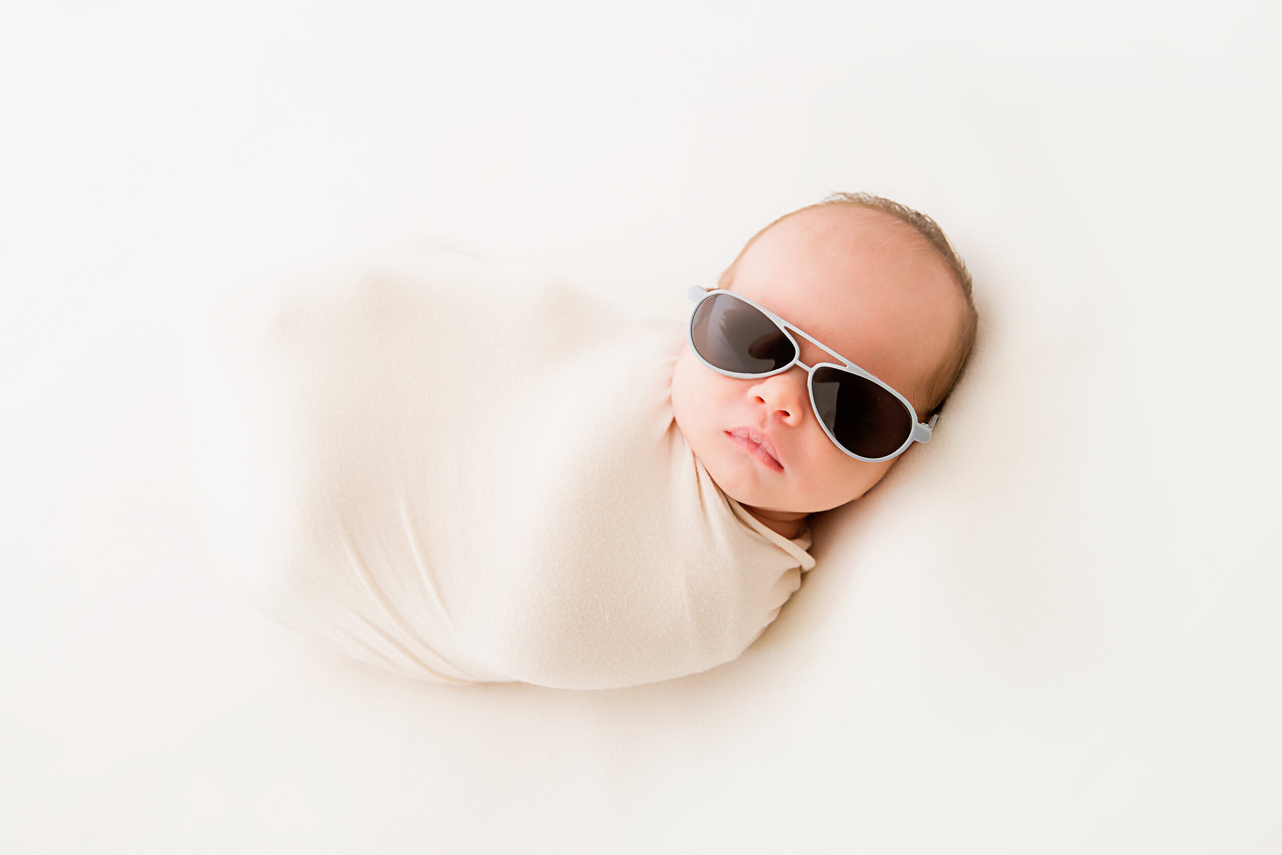 newborn-baby-boy-wearing-sunglasses
