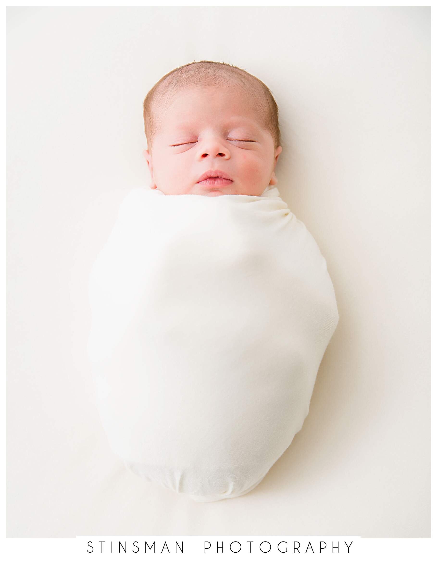 baby-wrapped-in-cream-natural-color-for-newborn-photo-shoot.jpeg