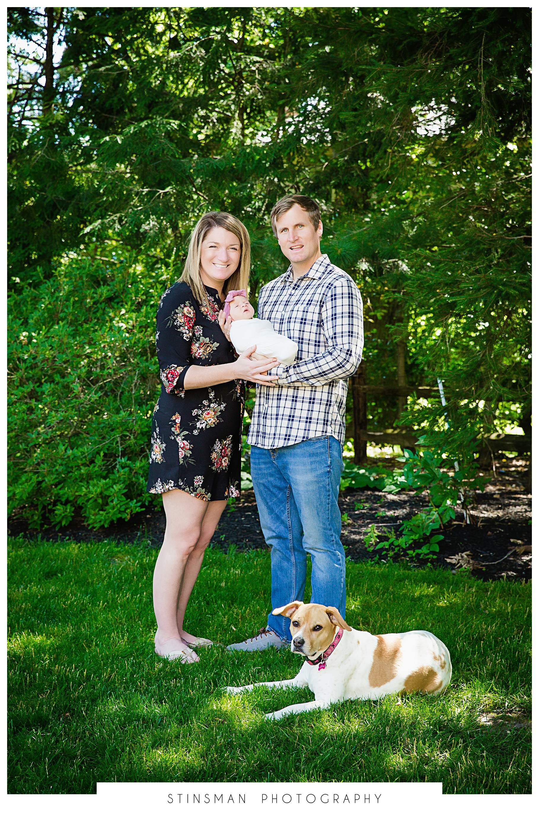 family of four with dog