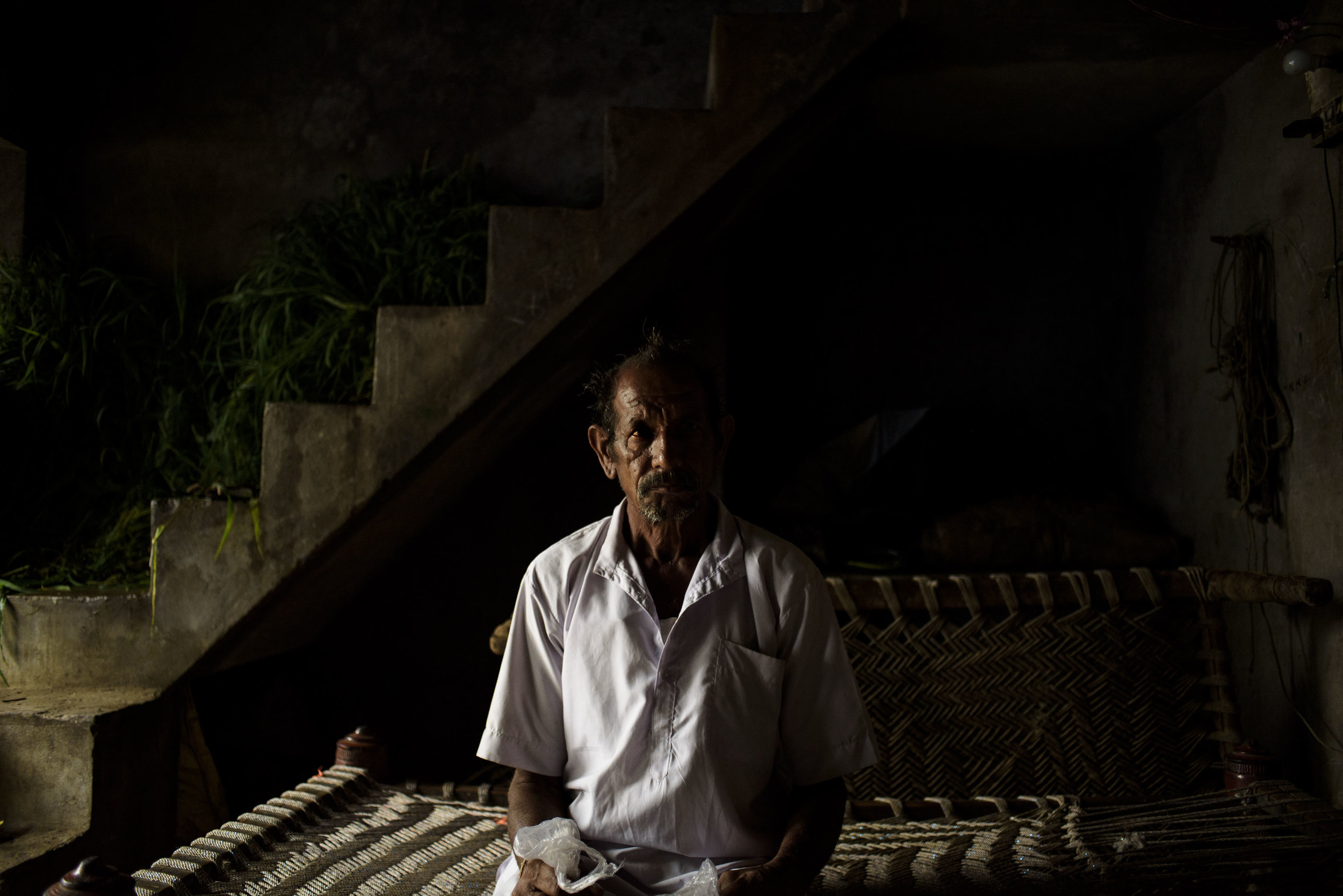 Nathu Homa, 60, a patient of Acute Hypertension sits in the courtyard of his house in Ratanpura Village of Banswara District. A farmer by profession, he has been one of the many tribal people to be benefitted by the Mukhyamantri Nishulk Dawa Yojna.