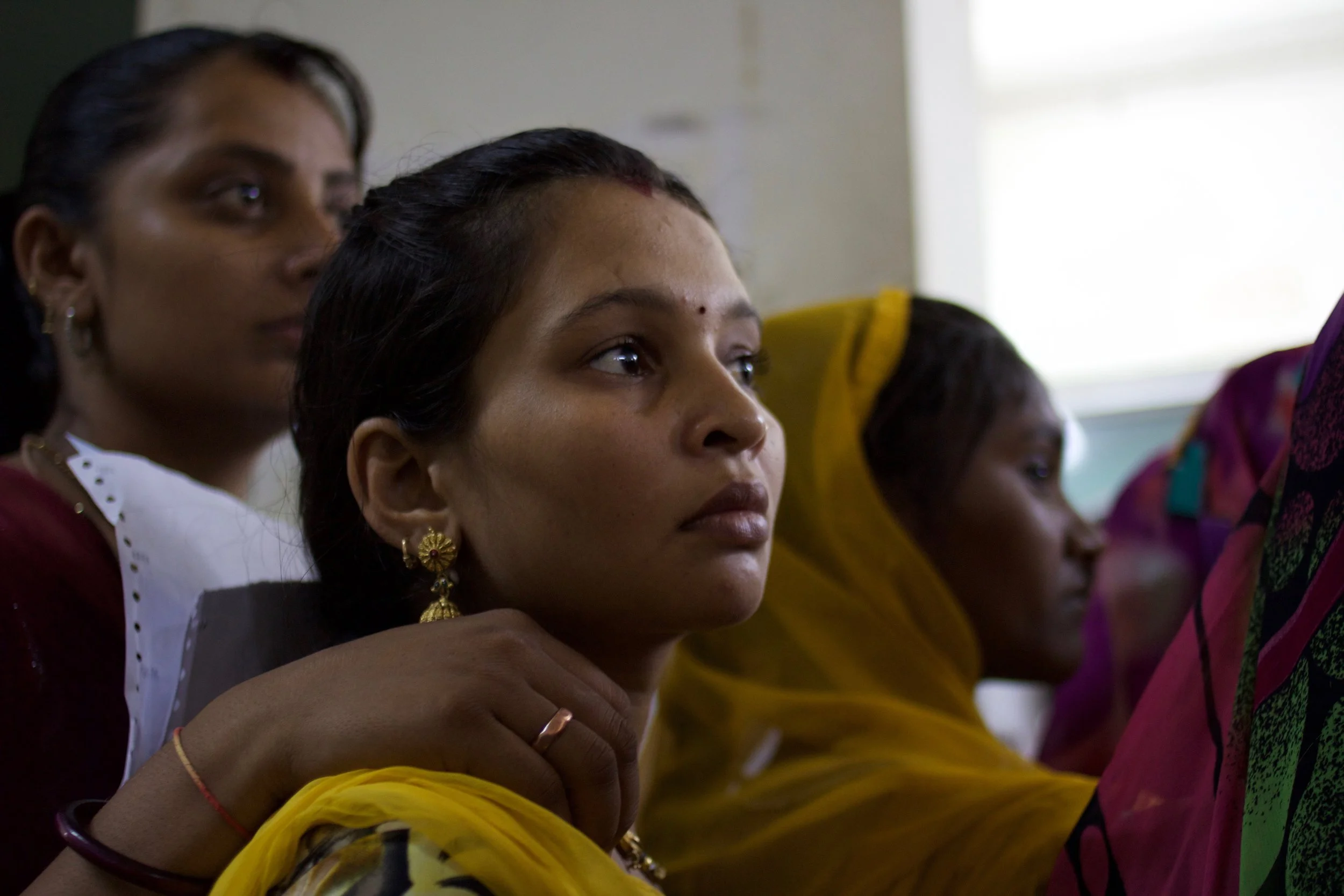 Pregnant patients who have come to Zanana Public Hospital for their regular check-up listen attentively for further instructions from the nursing staff.