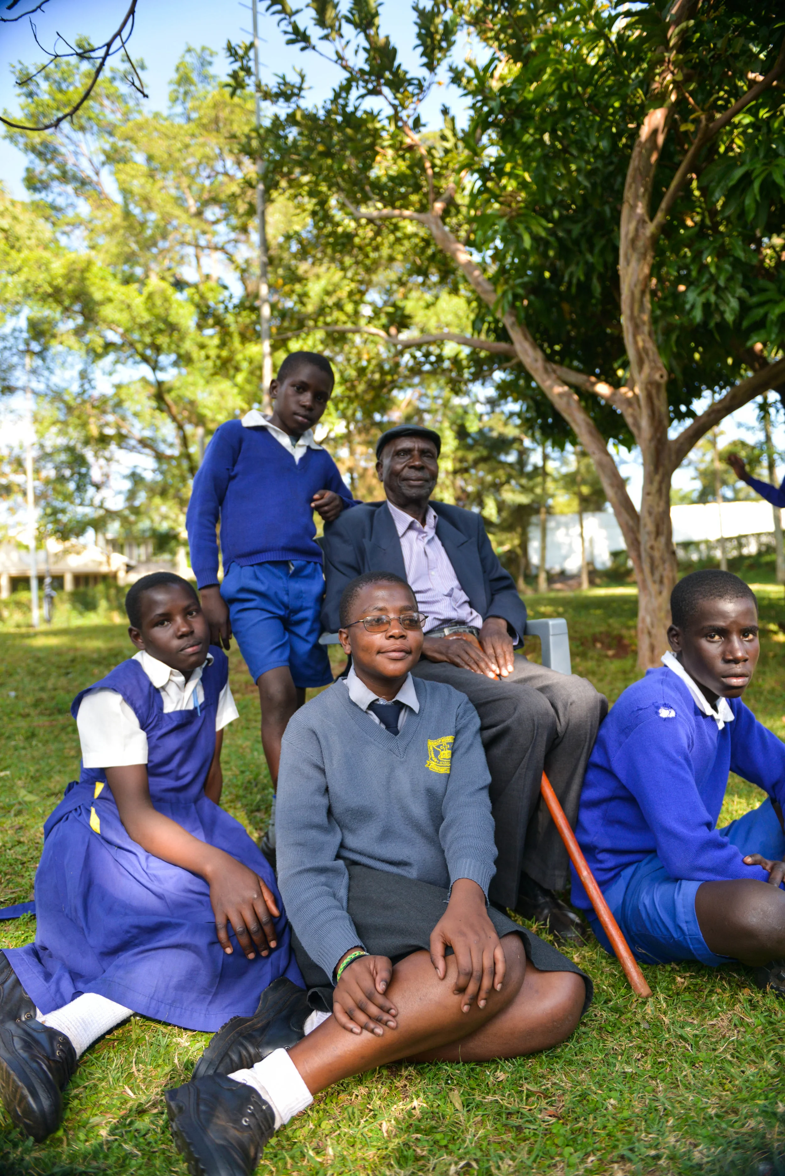 The Orioki children are all Ajiri scholars. Joyce, Eugene, Thomas, and Diana pictured here with their grandfather. 