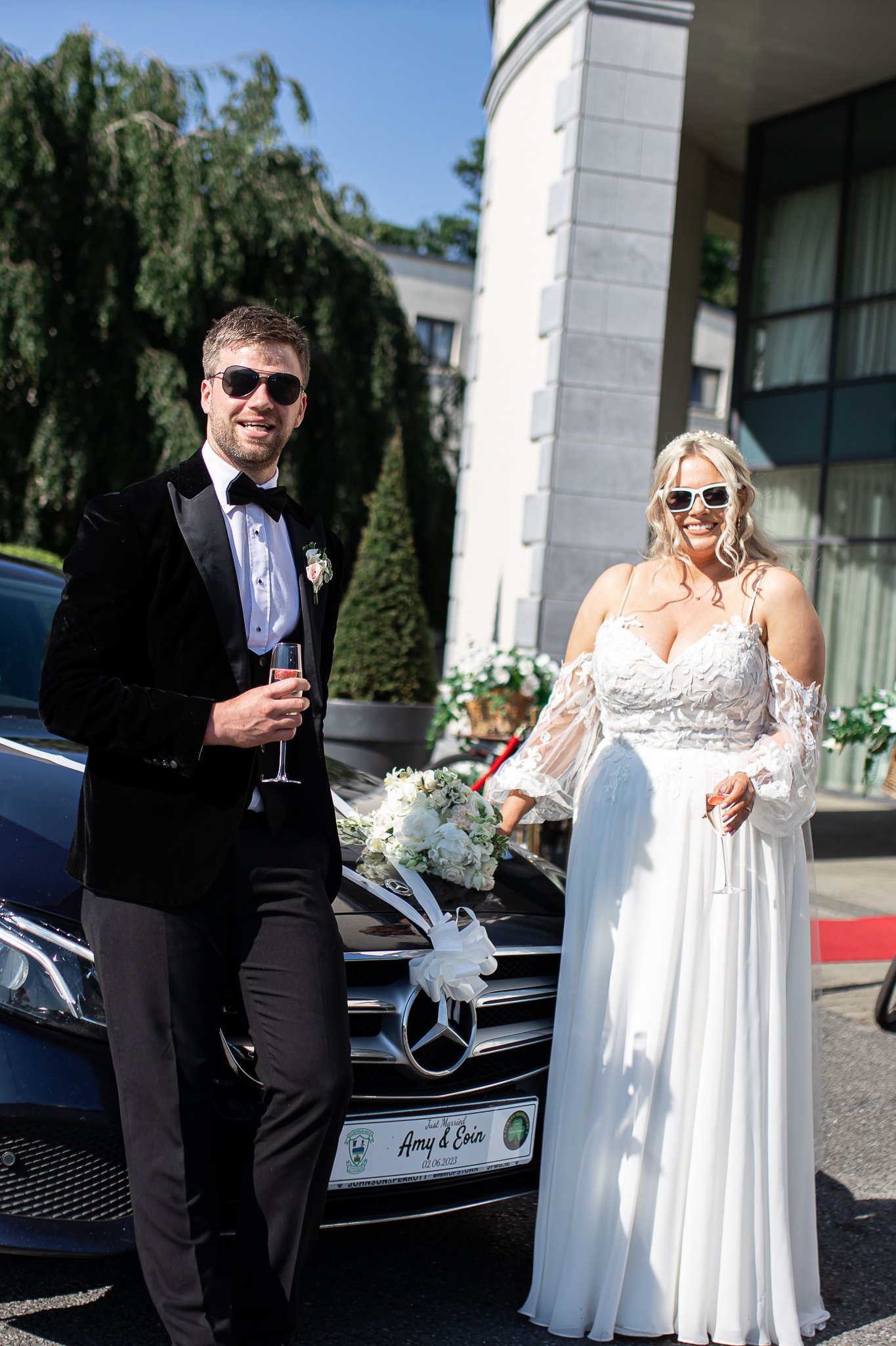 Bride and groom arrive at Newpark Hotel in style in a luxury vintage car. Magical summer wedding at Newpark Hotel in 2023.