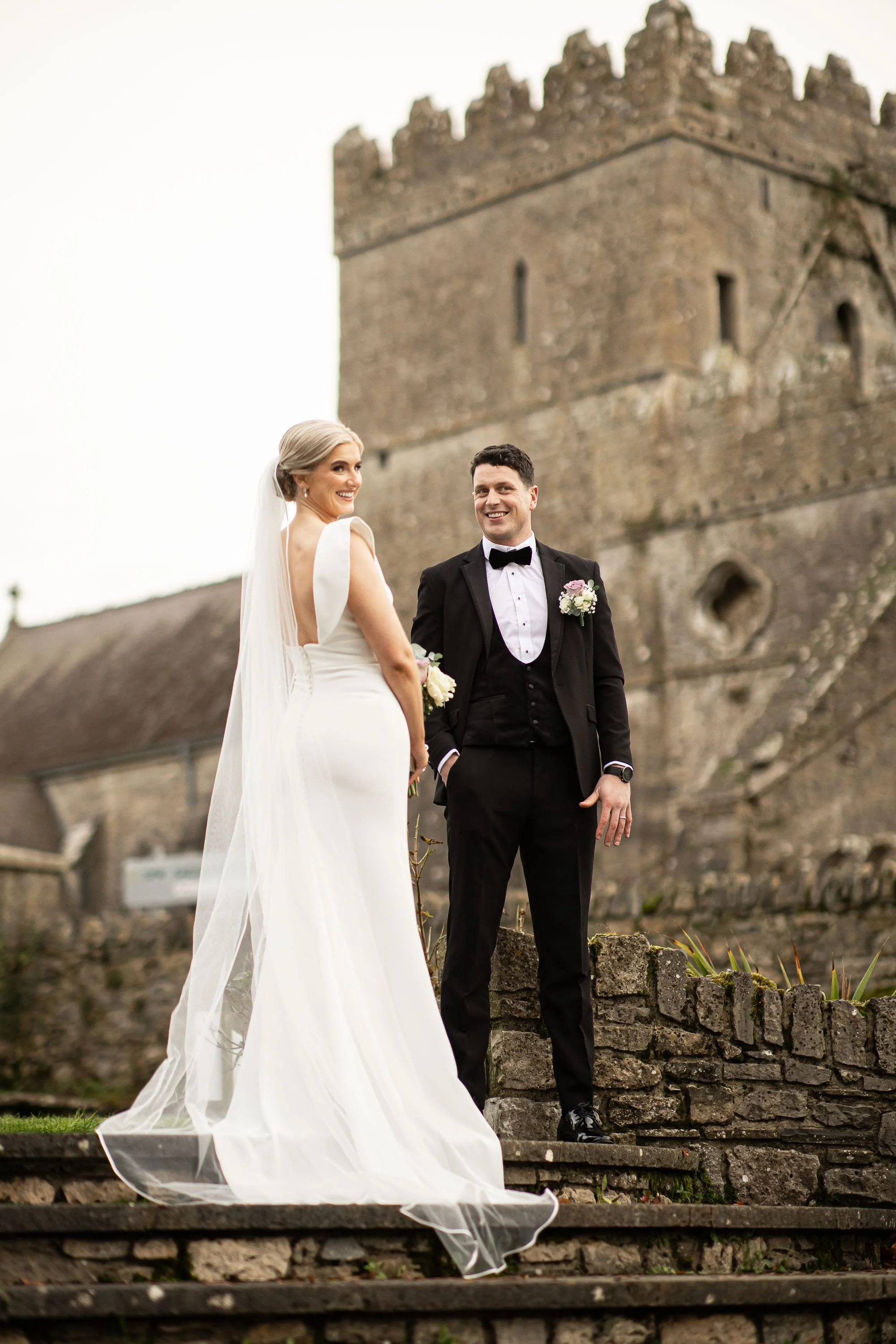 gowran-abbey-bride-and-groom-share-a-smile-folkster-gowns-kate-tobin-liam-ryan-wexford-senior-hurler-oc-wedding-videography-daragh-mccann-stargaze-photography.jpg