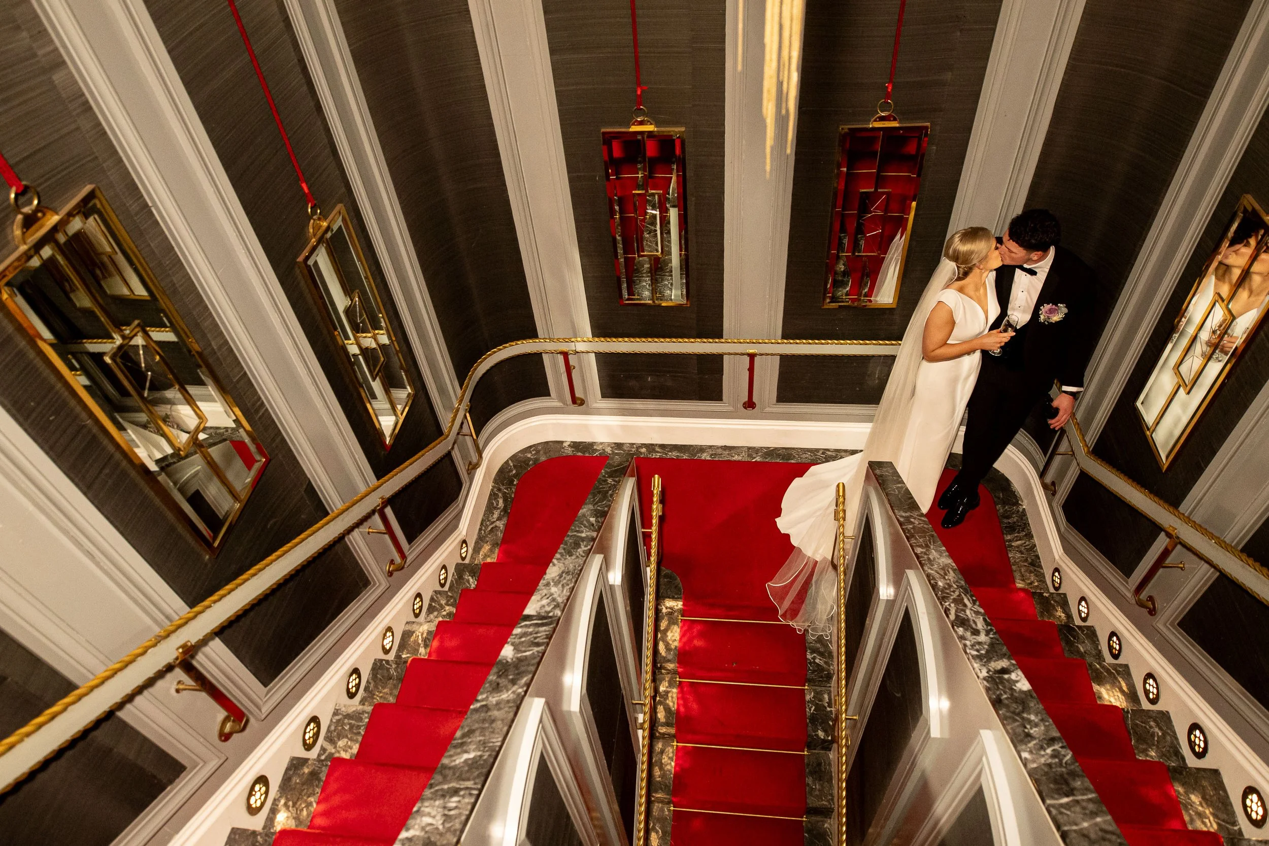 langtons-hotel-set-theatre-staircase-wedding-kiss-prosecco-daragh-mccann-stargaze-photography.jpg