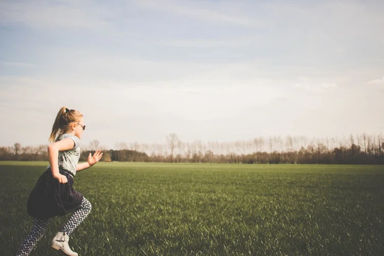 kid running through lawn.jpg