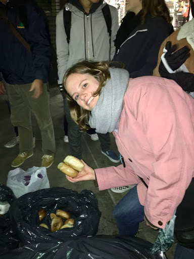  Josi Riederer, an NYU junior in GLS, eagerly picking up some bagels to take home.   