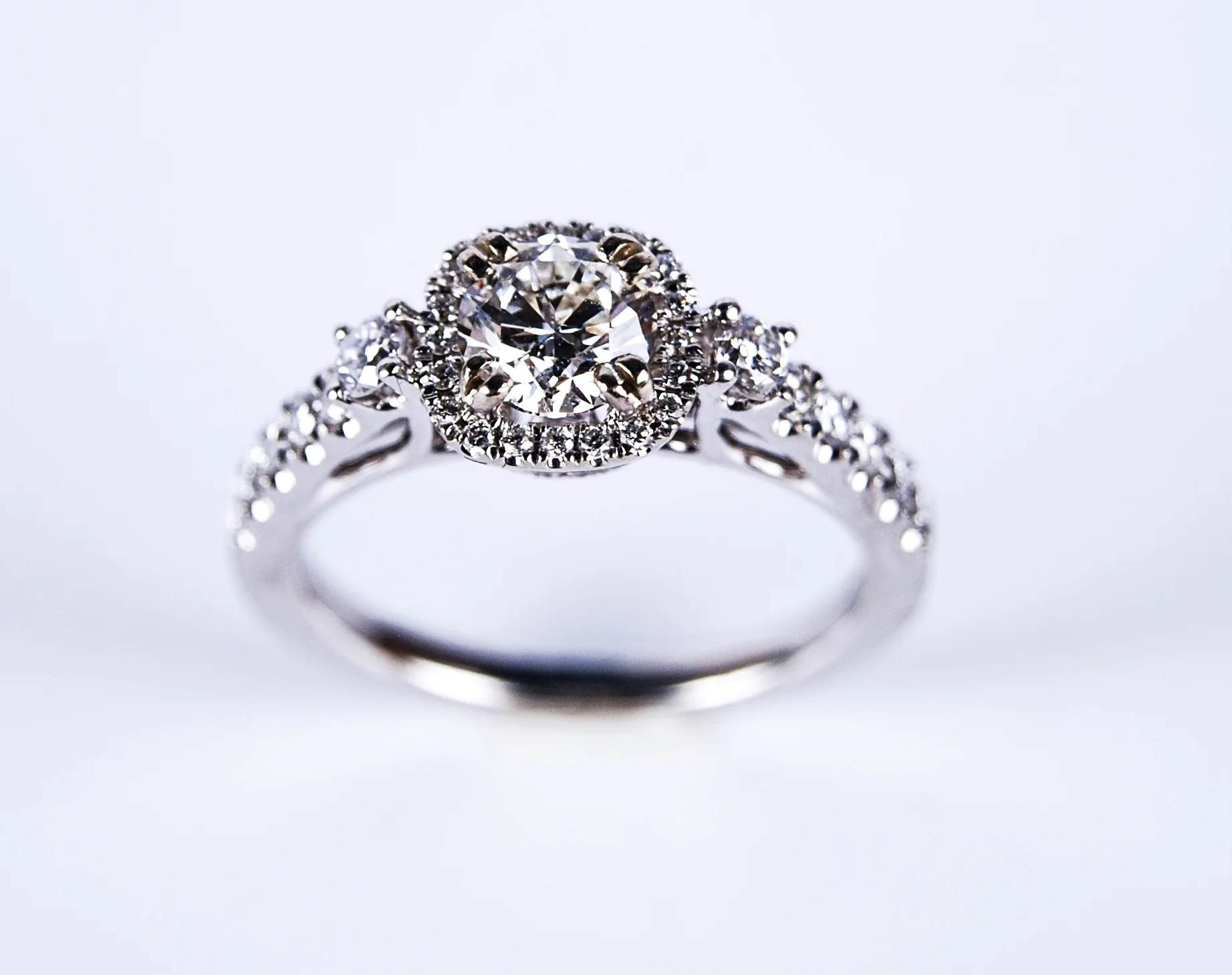 100-157 14 Karat white gold Engagement Ring With One 0.70Ct Round H Si1 Diamond And 0.62Tw Round G/H Si1 Diamonds $7,768.00