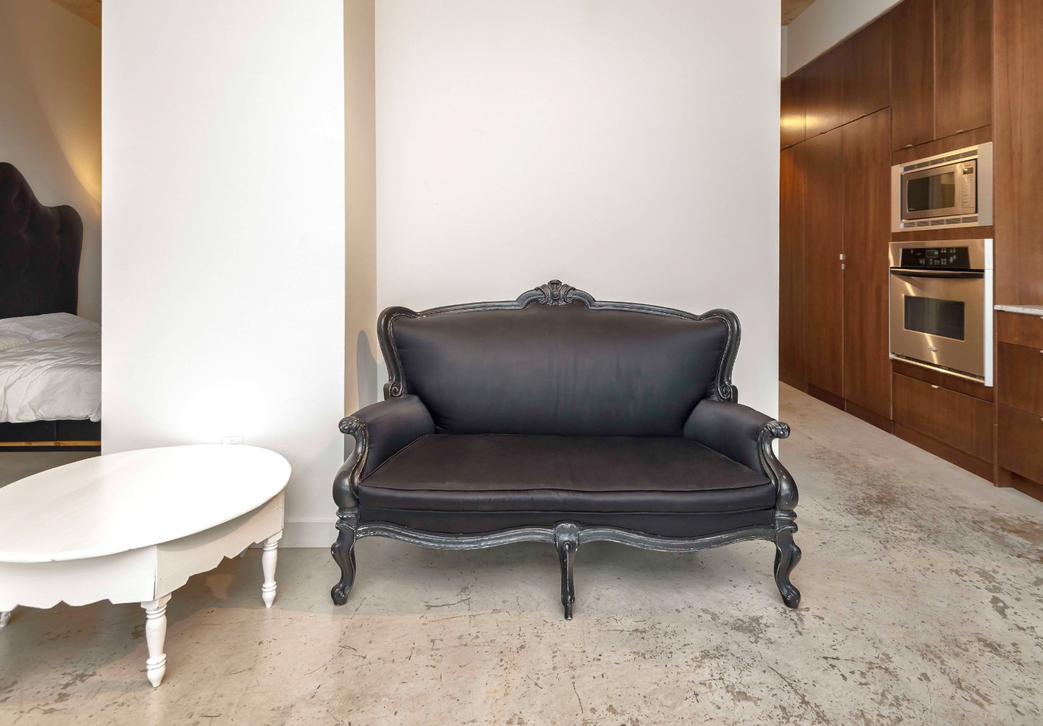 short term furnished rentals toronto Fashion District black sofa couch