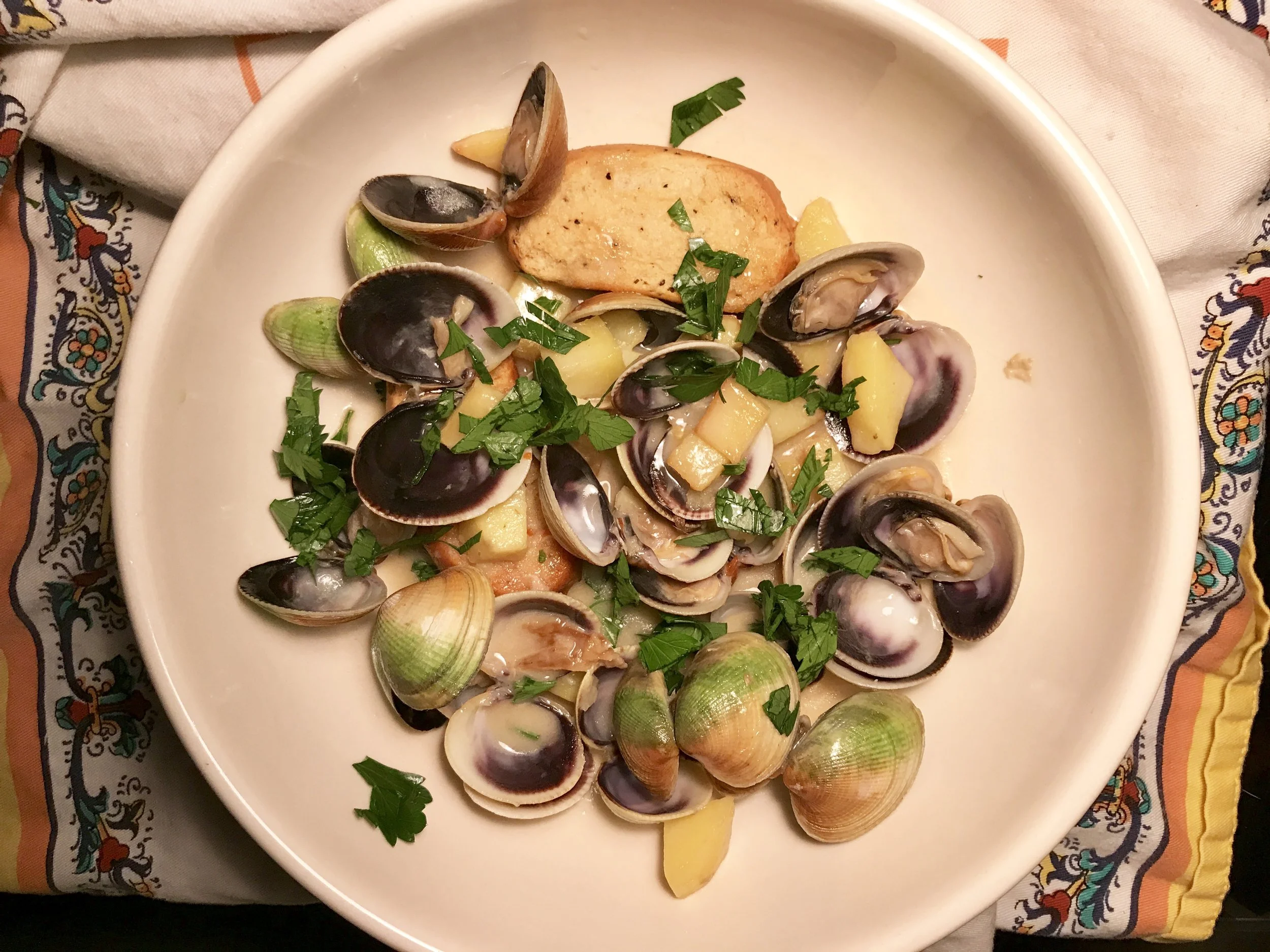 Vongole clams, potatoes and black pepper friselle to soak up the stew's broth.