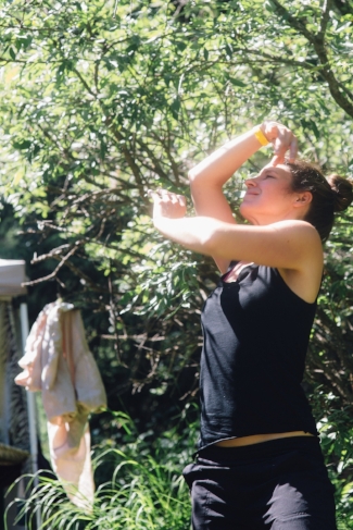 A participant in our workshop held at Frog Fest in 2017 explores movement and connection to self during our session.