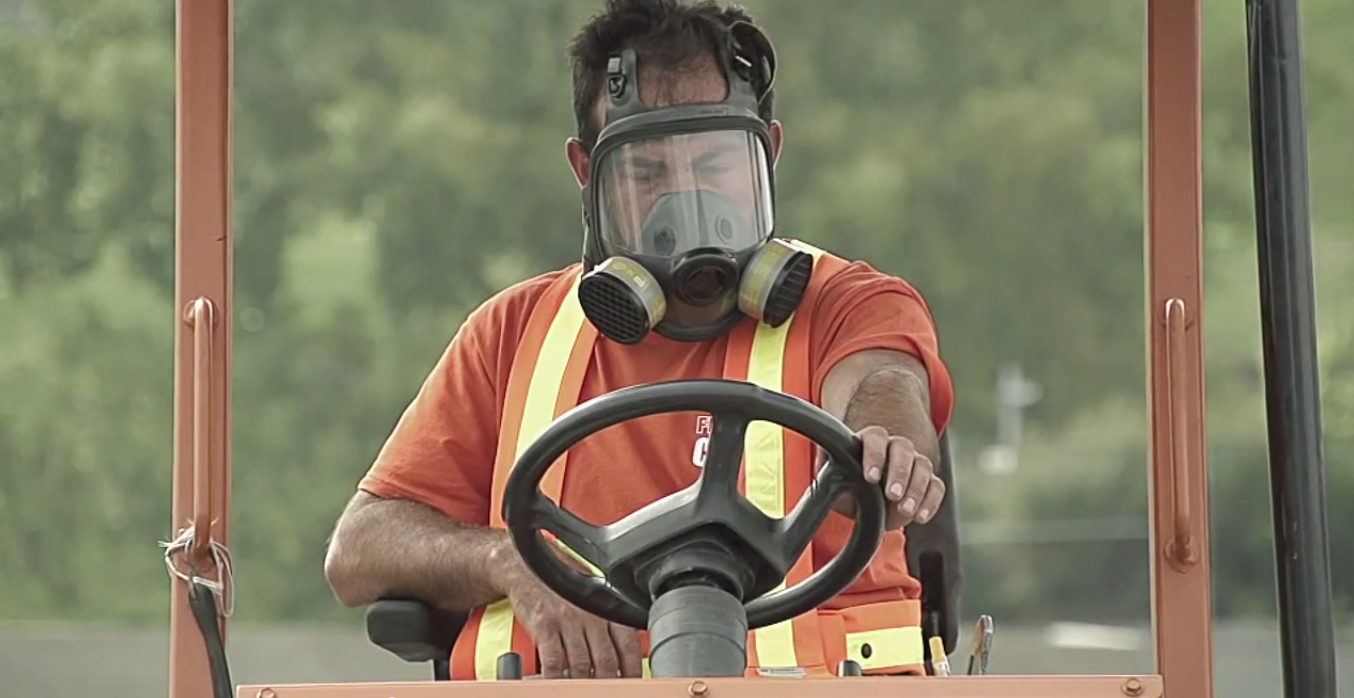 FieldTurf workers breathing masks -  Impact inaugurates new synthetic training field next to Stade Saputo 2.jpg