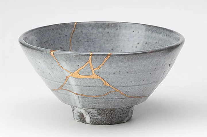 Kintsugi (or Kintsukuroi , which means “golden repair”) celebrates the is the centuries-old Japanese art of fixing broken pottery with a special lacquer dusted with powdered gold, silver, or platinum. Beautiful seams of gold glint in the cracks of ceramic ware, giving a unique appearance to the piece. This repair method celebrates each artifact’s unique history by emphasizing its fractures and breaks instead of hiding or disguising them. Kintsugi often makes the repaired piece even more beautiful than the original, revitalizing it with new life.