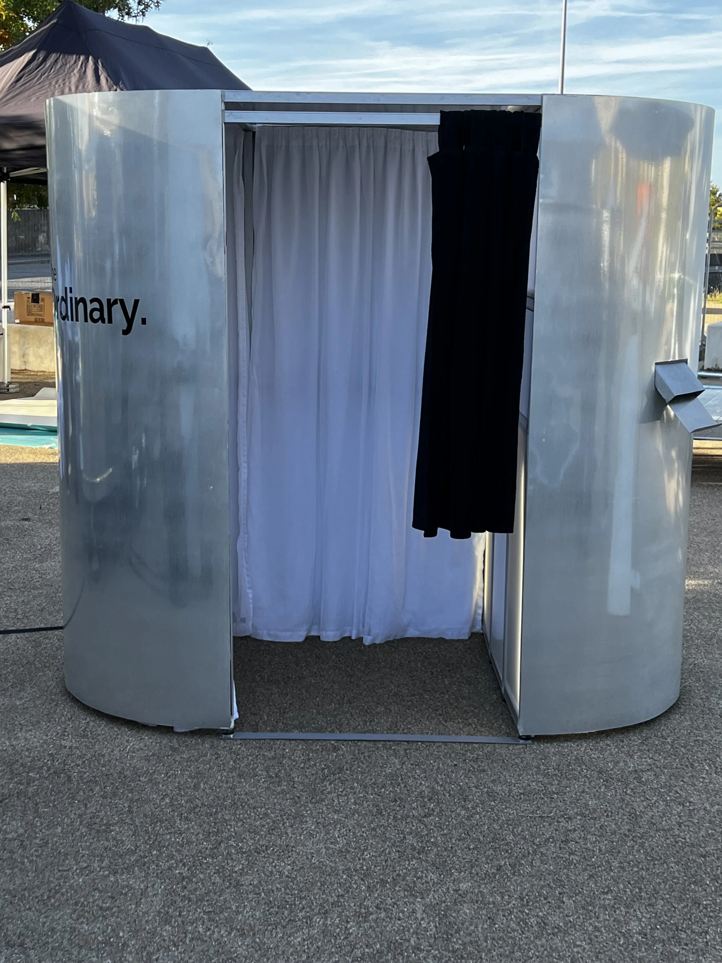 A branded photo booth for a promotional event. Hire a fully customised photo booth.