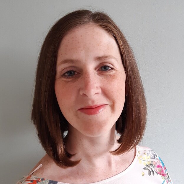 Clare Blissett, CBT Therapist, a smiling woman wearing a cream top posing in front of a plain background