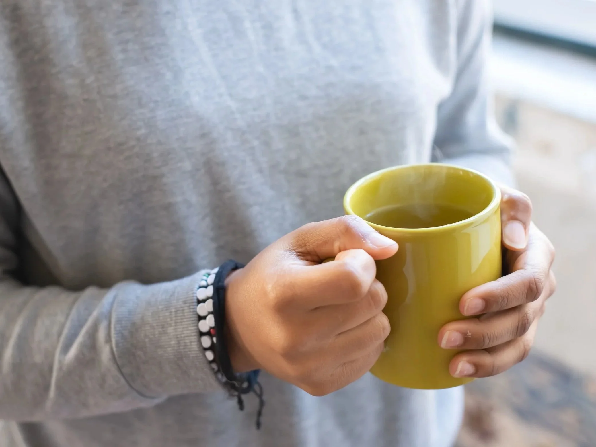 hands around a warm mug - Mindfulness in action