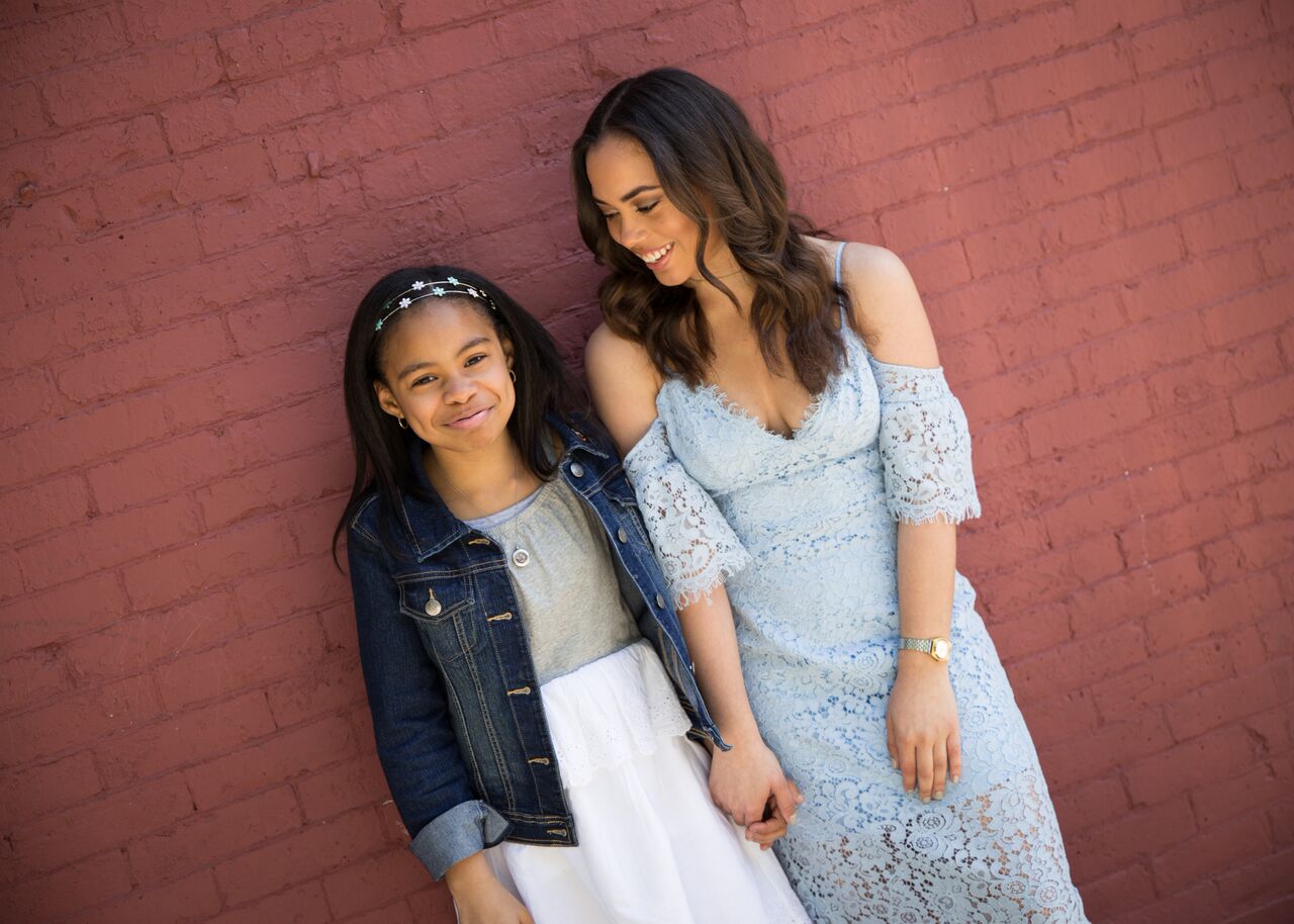Tiana is wearing a dress by Gap with denim jacket and headband by Children's Place . This beautiful light blue lace dress is by Bardot and available at Revolve .
