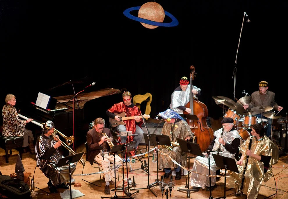   SUN RA TRIBUTE  ... A cast of Seattle improvisers and performers comes together every blue moon to honor and celebrate the music of the legendary space traveller. Featuring Stuart Dempster on trombone and William O. Smith on clarinet, this group ha