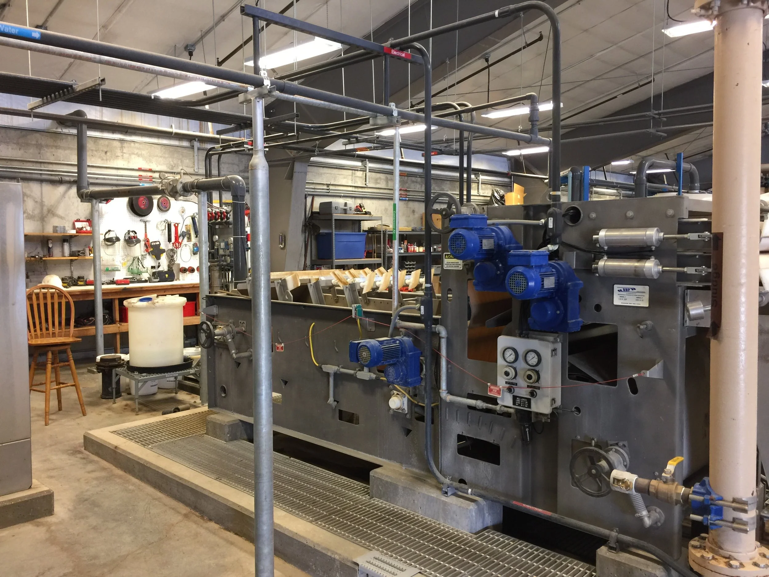 13. Belt filter press - Used to remove the most of the water from the sludge in the backwash tank prior to disposing.