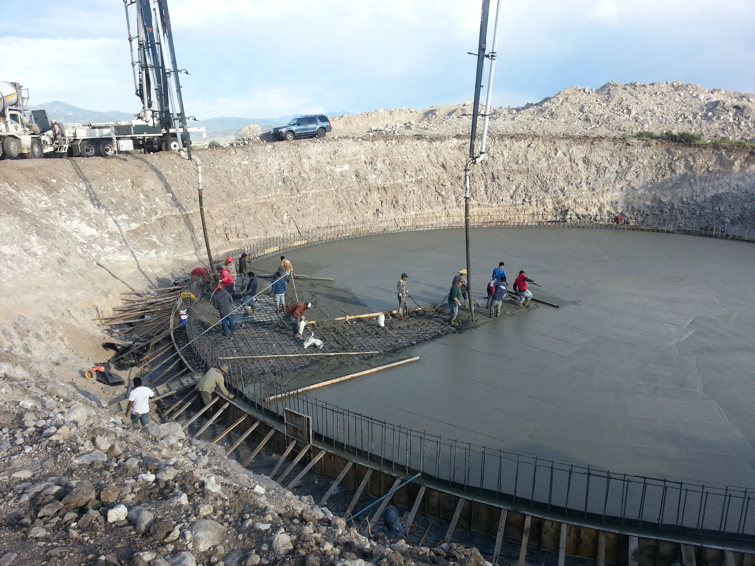 Pouring the floor and footing of the new water tank.
