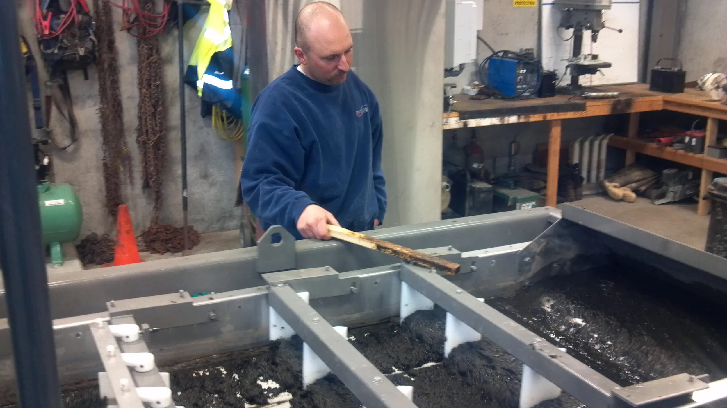 Operating the Belt Filter Press - which removes water from the plant waste sludge, to allow for proper disposal.