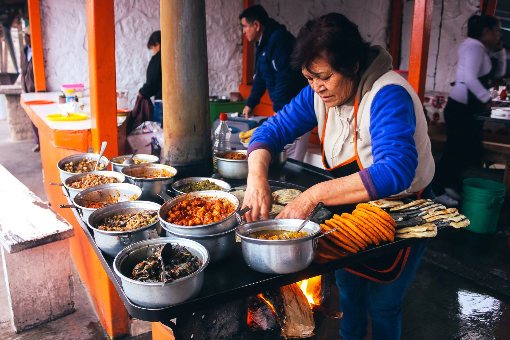 A woman makes gorditas at Divisadero Station, a stop on the way to Urique laying at the base of the Copper Canyons.