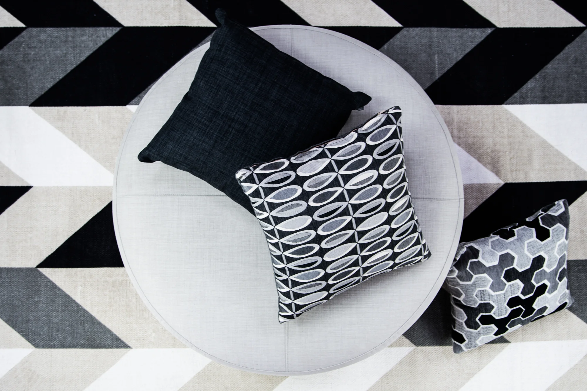 Polly Ash with Lunar Graphite and Carlisia Black Scatters with Lunar Soft Grey on ottoman