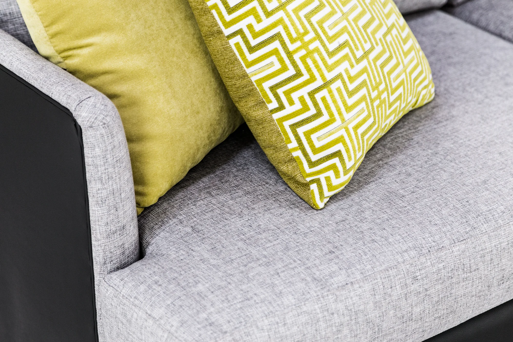 Sofa: Safari Volcanic Rock with Stamford White Ash, Scatters (left to right): Leo Citron, Oscar Charge with Delight Lemongrass