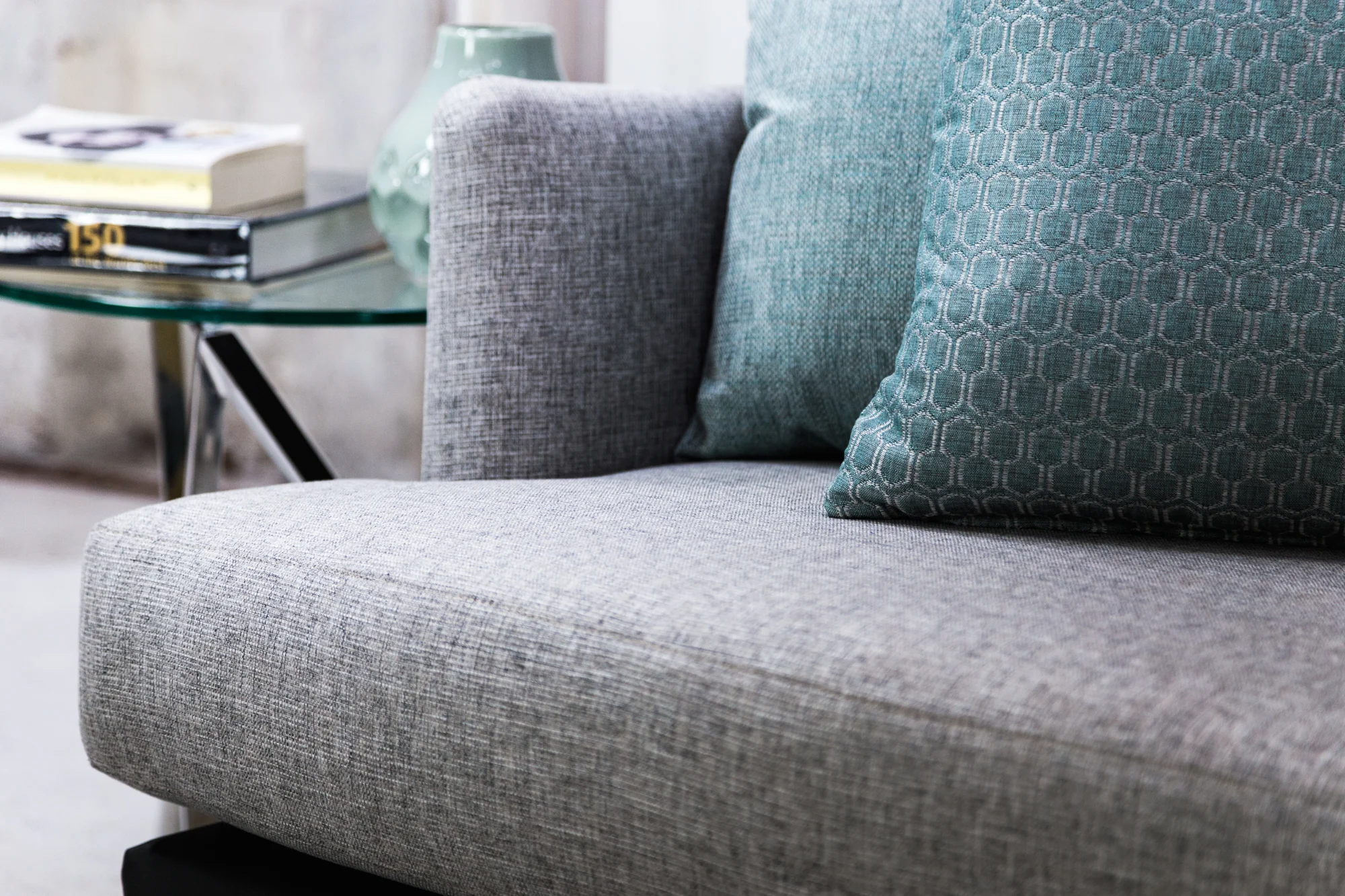 Scatters (from left to right): Echo Teal, Tribeca Teal. Sofa: Stamford White Ash.