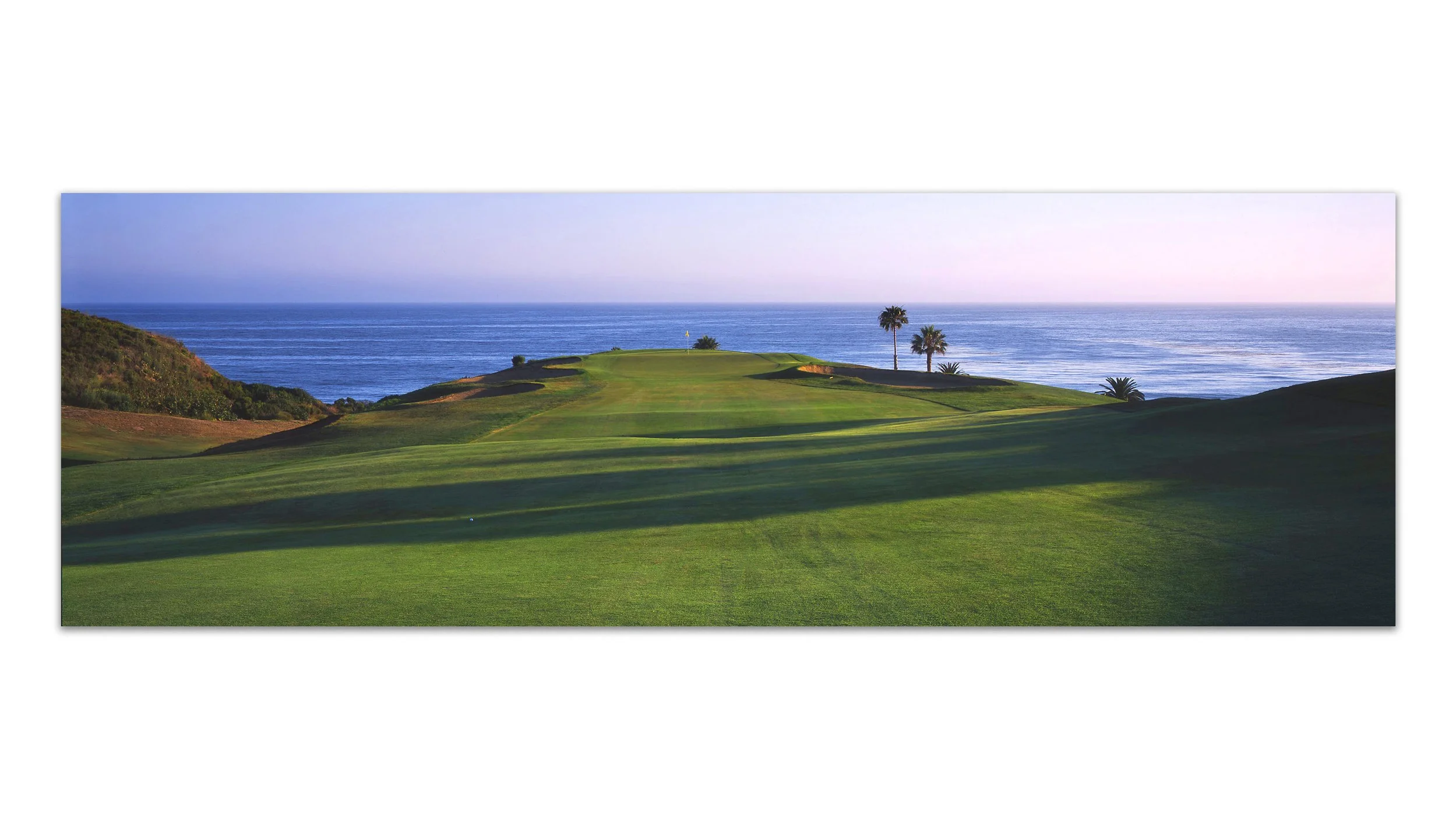Fairway to Heaven | Edition of 18 | Single Exposure on Fuji Provia FILM After hitting my tee shot (and I promise this ball landed here naturally) I approached the green and was immediately struck by the perfection of this scene in all aspects - composition, timing, light play, and even the symbolic relevance. Few things on earth exert the body and mind like the game of golf. It is a game of paradox - of peace and madness, love and hate, rhythm and stillness, and learning from mistakes while simultaneously removing them from memory. A game that truly cannot be beaten, it offers a challenge as infinite as the Pacific that stretches on to the Horizon behind the green. “What course is this?”, you might be wondering. I will let you know only after you purchase the piece. ;) 20x60, 24x72, 30x90, 40x120, 50x150 (Panels Only)